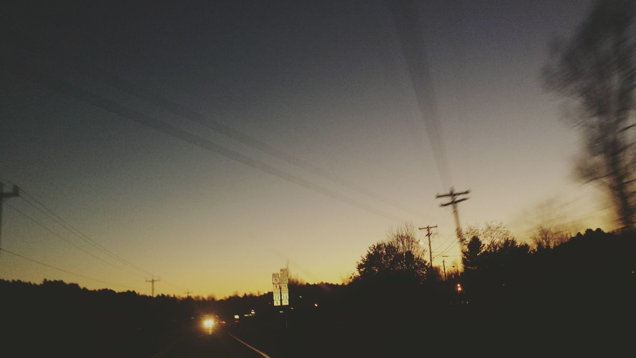 silhouette, sunset, transportation, sun, mode of transport, fuel and power generation, sky, street light, car, tree, electricity pylon, road, nature, power line, electricity, sunlight, beauty in nature, technology, scenics, outdoors