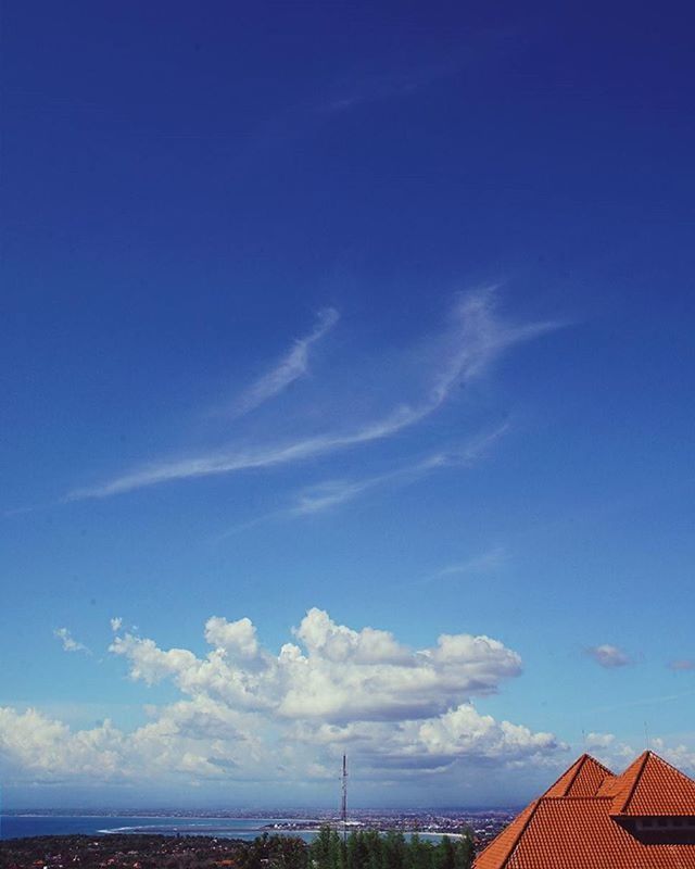 blue, sky, cloud, tranquility, scenics, cloud - sky, tranquil scene, beauty in nature, built structure, nature, building exterior, architecture, low angle view, outdoors, day, roof, no people, horizon over water, idyllic, sea