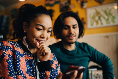 Young couple looking at camera