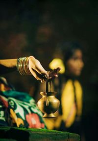 Close-up of hand holding wineglass