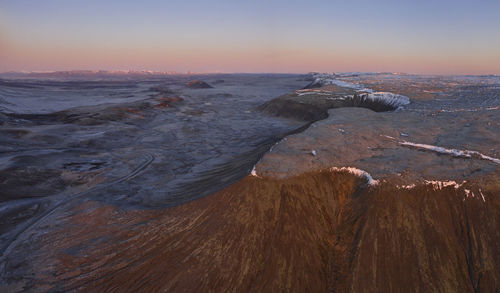 Rough volcanic terrain during sunset