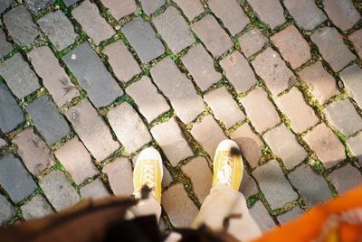 Low section of person walking on footpath