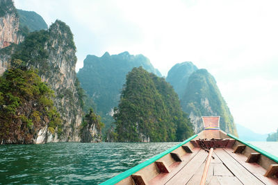 Scenic view of sea and mountains against sky