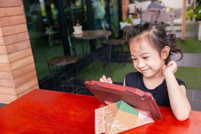 Portrait of cute girl studying at home