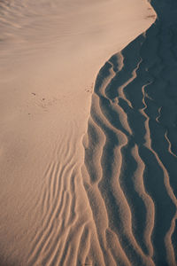 High angle view of sand dunes at beach