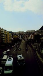 High angle view of traffic on road amidst buildings in city