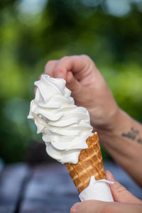 Hand holding ice cream