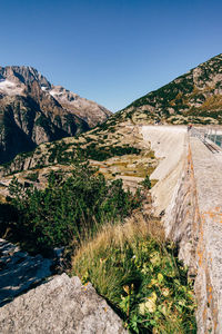 Scenic view of mountains against clear blue sky