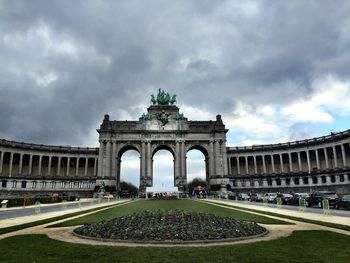 Low angle view of historical building against cloudy sky