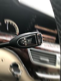 Close-up of gearshift in car