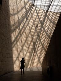 Woman walking in tunnel