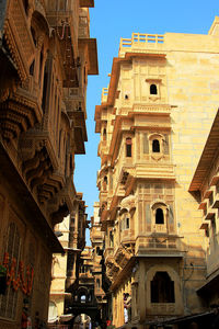 Low angle view of buildings against sky in city