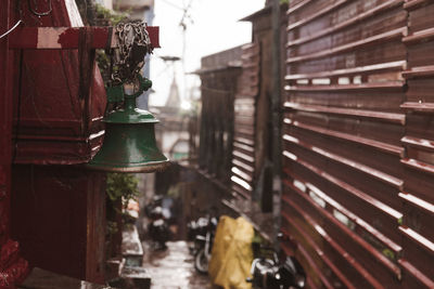 Close-up of bell hanging outside building