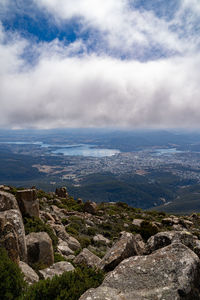 Scenic view of sea and mountains against sky