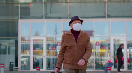 Full length of man standing in city