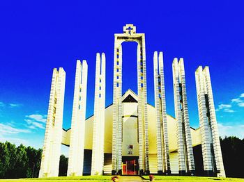 Low angle view of built structure against blue sky