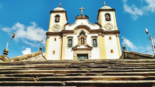 Low angle view of church against blue sky