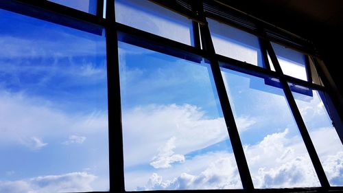 Low angle view of sky seen through window