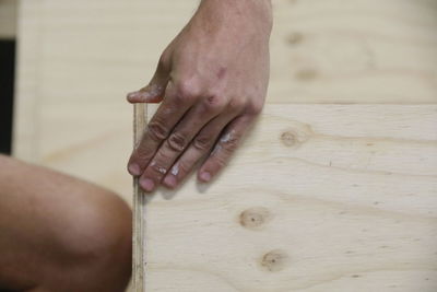 Close-up of man hand on table