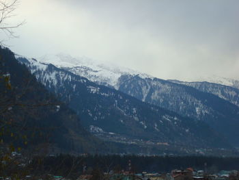 Scenic view of mountains against sky during winter