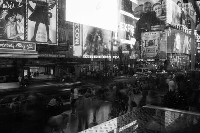 Crowd on city street at night