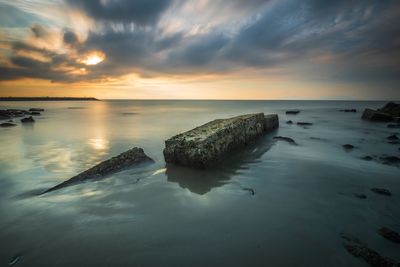 Scenic view of sea against sky during sunset