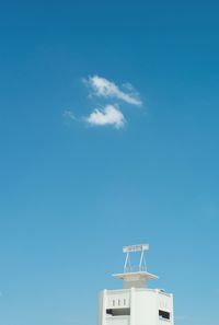 Low angle view of building against blue sky