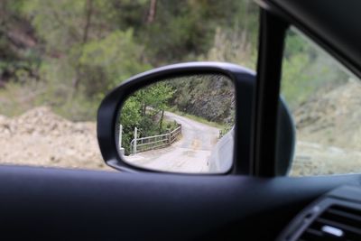 Reflection of car on side-view mirror