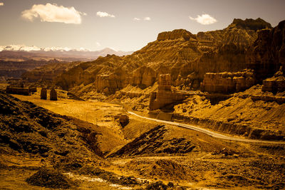 Scenic view of landscape and mountains against sky