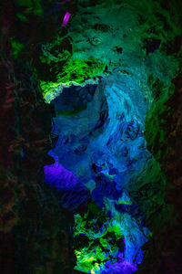 Close-up of illuminated rock in water at night