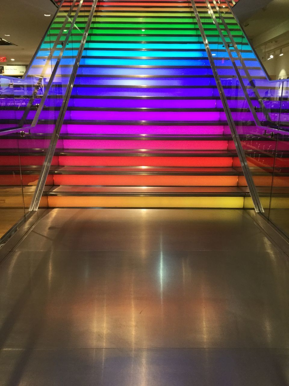 ILLUMINATED LIGHTS ON TILED FLOOR BY BUILDING