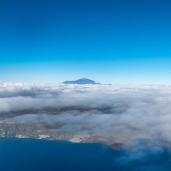 Scenic view of landscape against blue sky