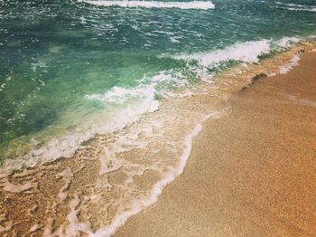 High angle view of surf on beach