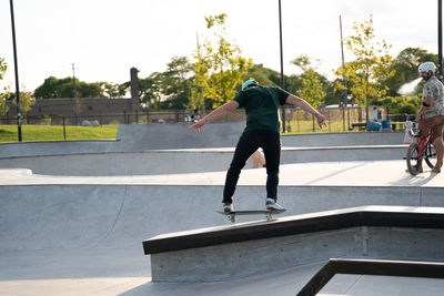 Full length of man skateboarding on skateboard