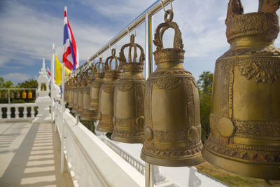 Brass bell hanging by a long line  at  thai  temple