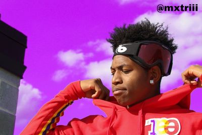 Portrait of young man looking away against sky