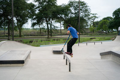 Full length of man skateboarding on skateboard park