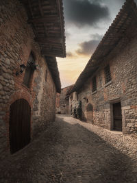 Empty alley amidst buildings in town