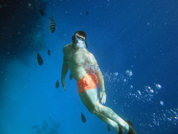 Man swimming in sea