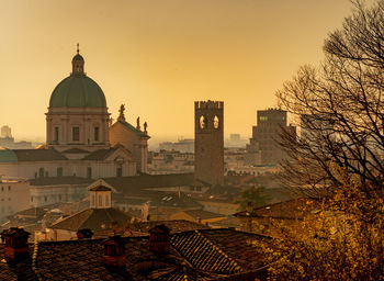 The silhouette of the cathedral of the city of brescia in a sunset light