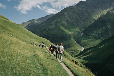 People walking on mountain road