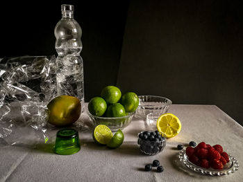 Various fruits in glass on table