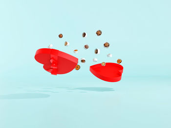 Close-up of red umbrella against blue background