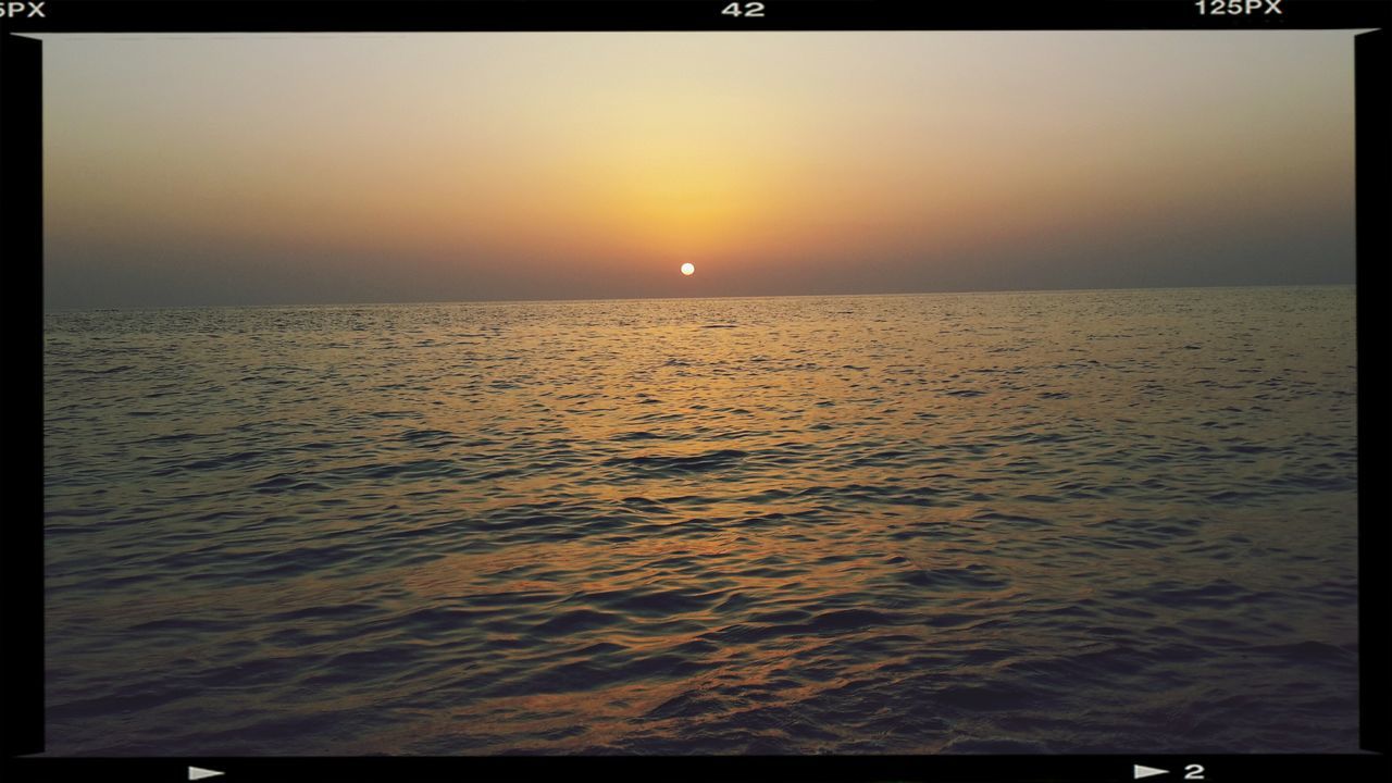 transfer print, sunset, sea, water, auto post production filter, scenics, horizon over water, tranquil scene, sun, beauty in nature, tranquility, orange color, idyllic, nature, rippled, clear sky, waterfront, sky, seascape, reflection