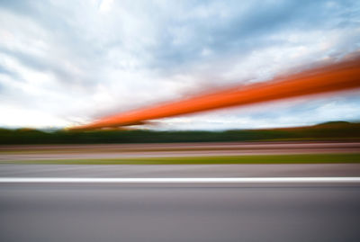 Blurred motion of road against sky