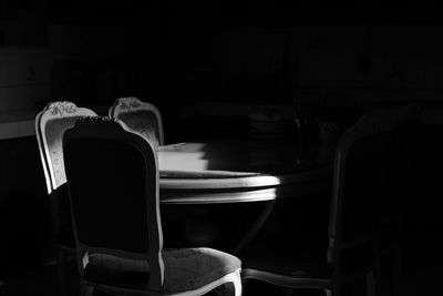 Empty chairs and tables in the darkroom