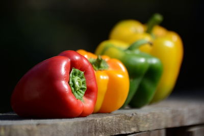 Close-up of various bell peppers on table