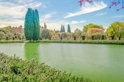 Panoramic view of lake and buildings against sky