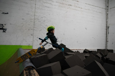 Side view of man looking at building