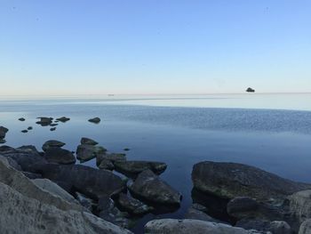 Scenic view of sea against clear blue sky